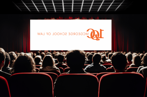 Cinema blank screen and people in red chairs in the cinema hall. Blurred People silhouettes watching movie performance.